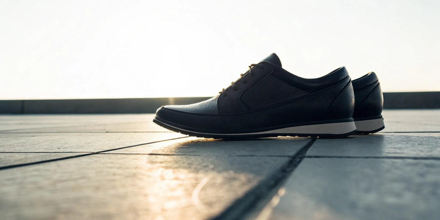 Stylish black shoes add 2 inches of height.