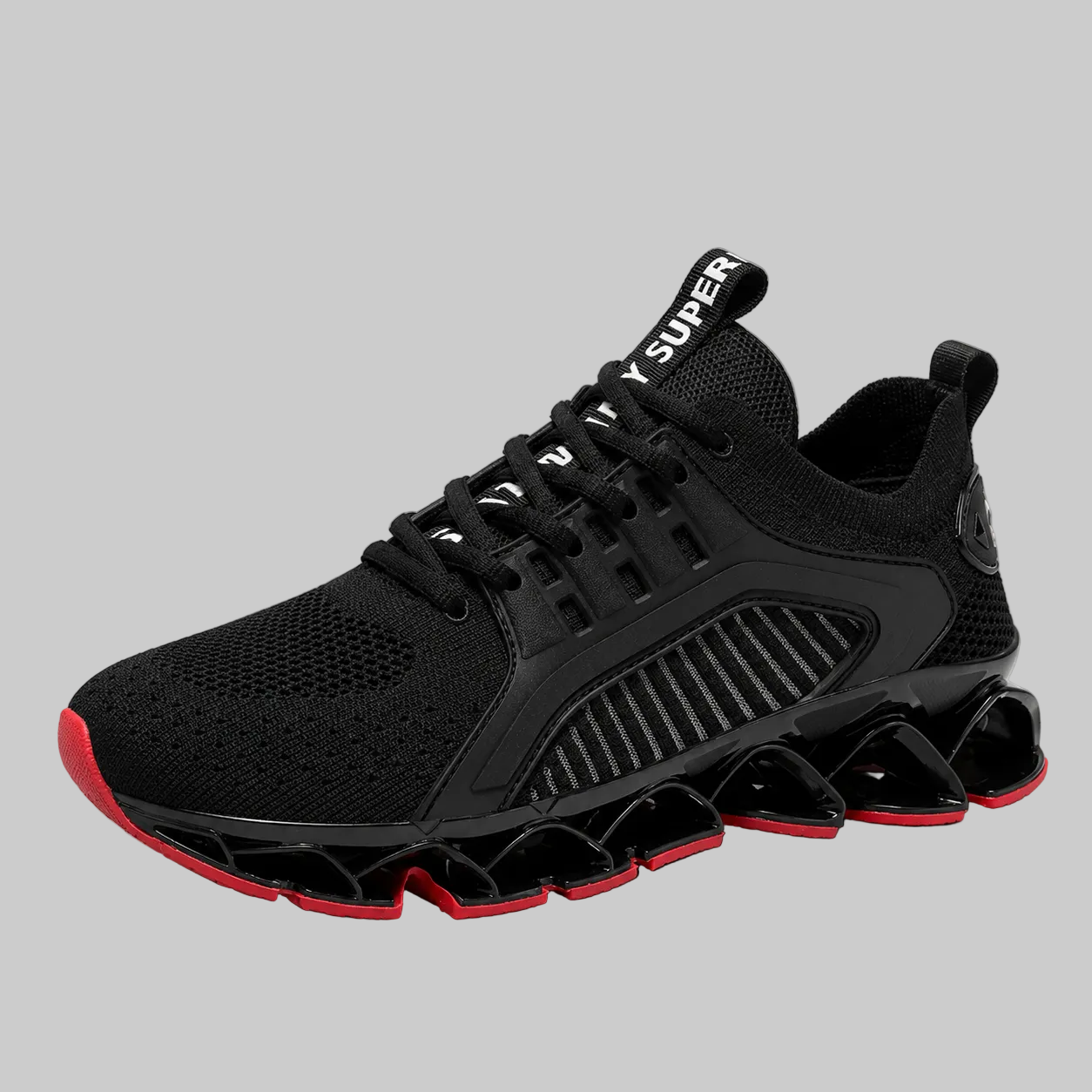 A black athletic sneaker with a chunky, wavy black sole featuring red accents on the toe and outsole, set against a solid gray background.