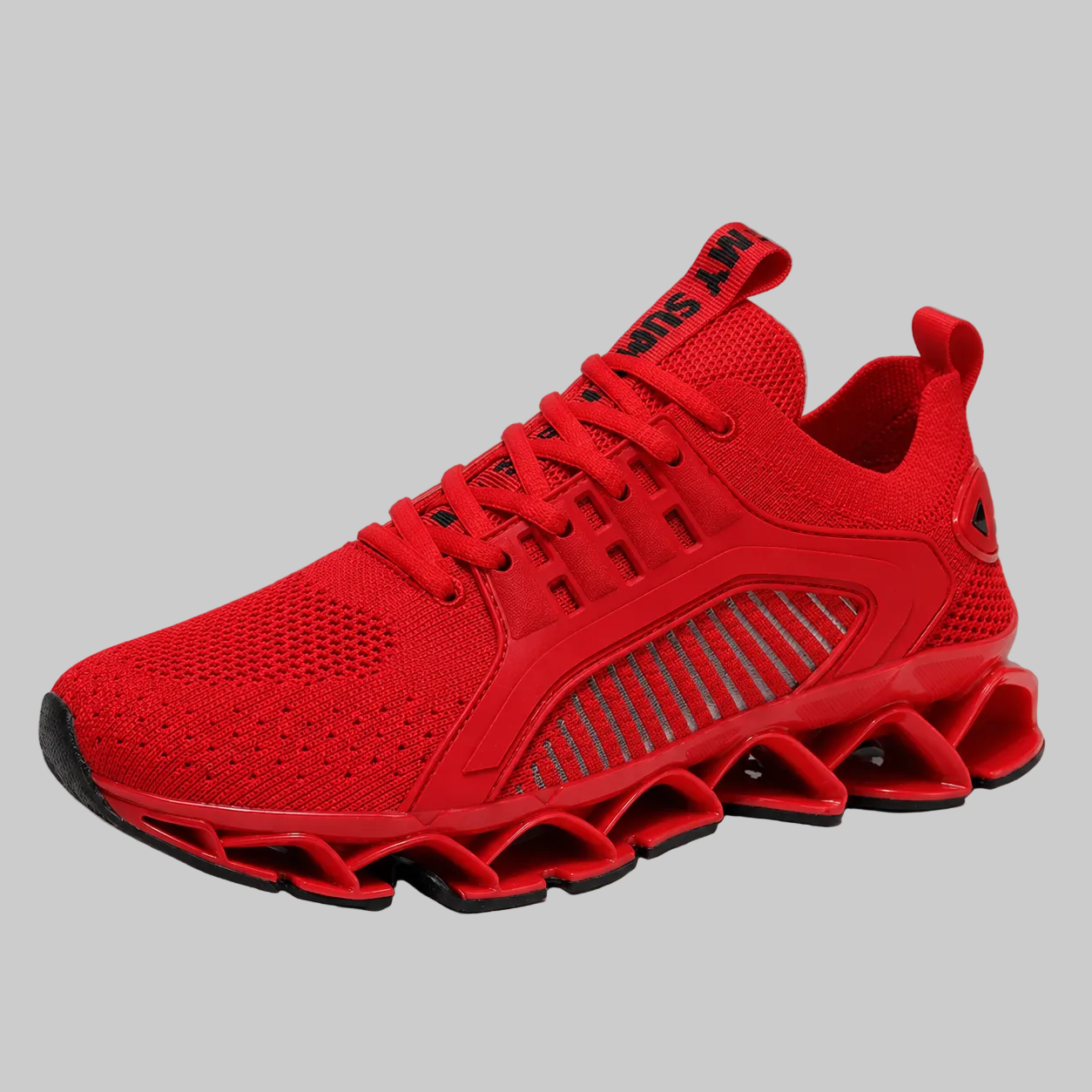 A bright red athletic sneaker with a textured knit upper, matching red laces, and a distinctive wavy, segmented sole, shown against a neutral gray background.