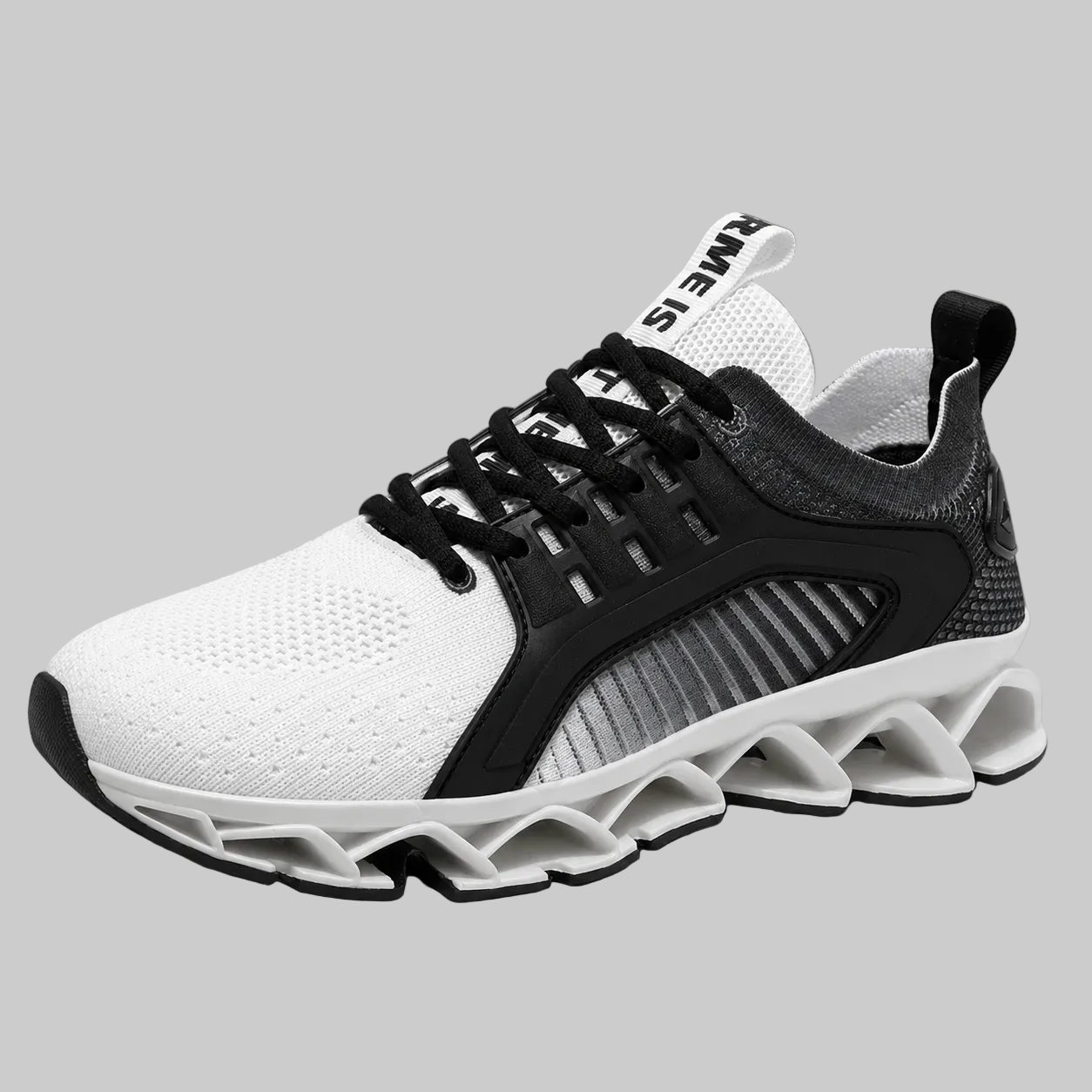 A white and black athletic sneaker with a chunky, sculpted sole, shown from a three-quarters angle on a neutral gray background.