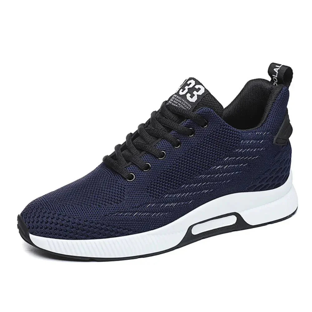 Navy blue athletic shoe with white sole on a white background
