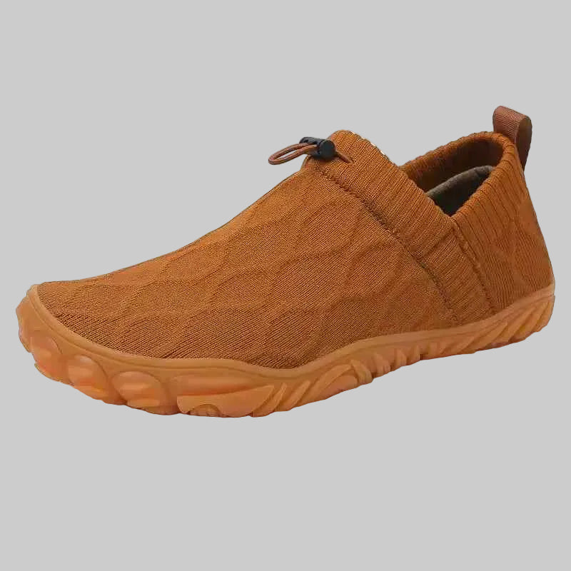 Brown slip-on shoe with textured surface on a white background