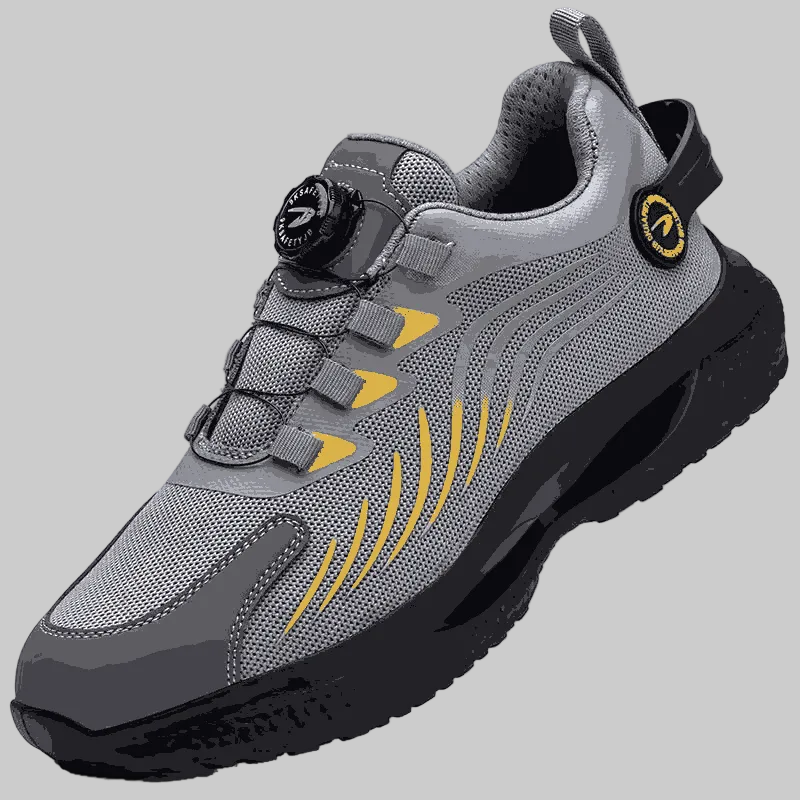 Gray and yellow athletic shoe on a white background